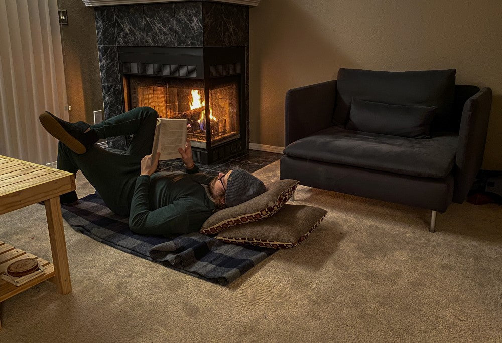 wool blanket warm laying in base layers by a fire place
