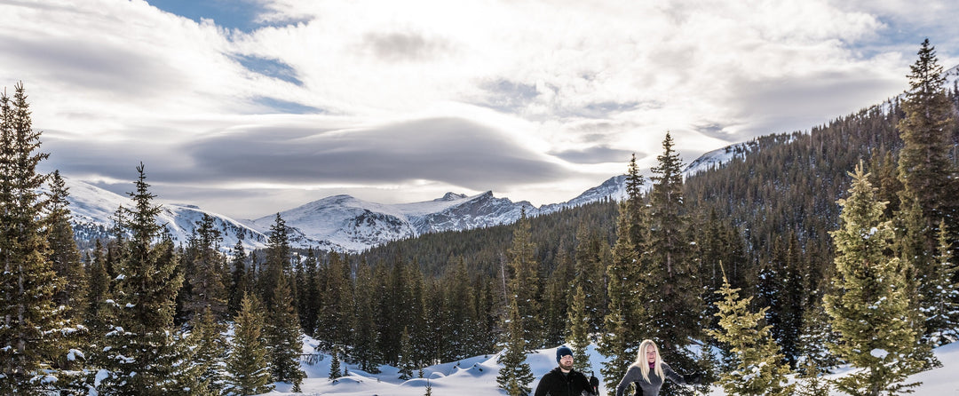 Couple Snowshoeing in the Mountains