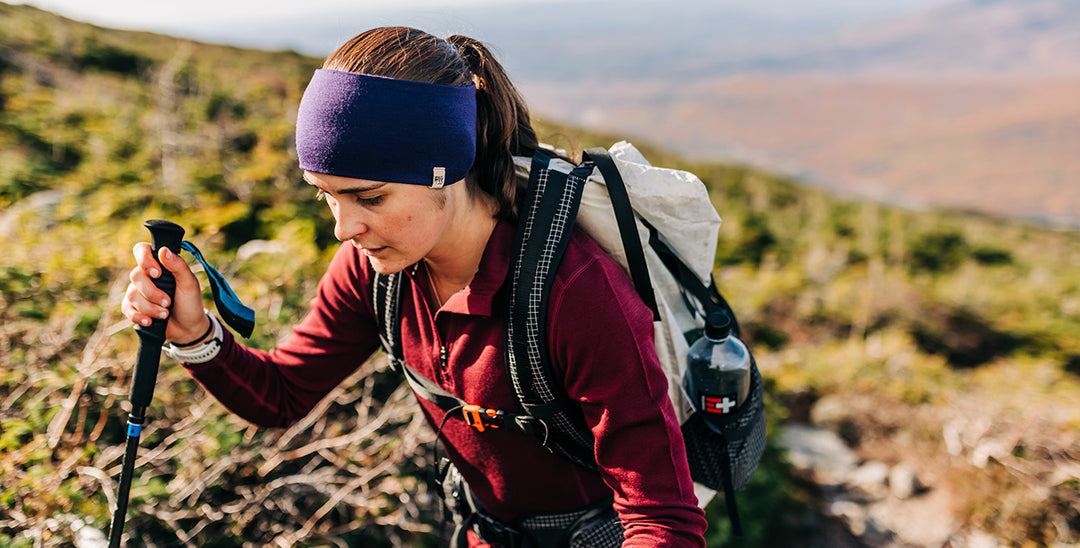 woman hiking wearing reversible headband