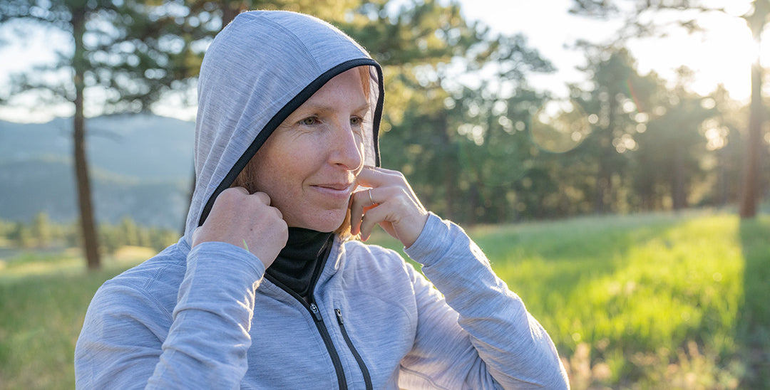 woman wearing woolverino micro weight sun hoodie and multiclava 