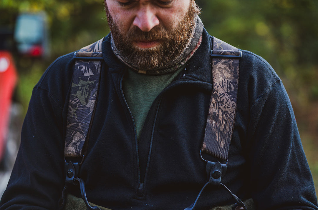 man hunting wearing minus33 merino wool expedition mid layer