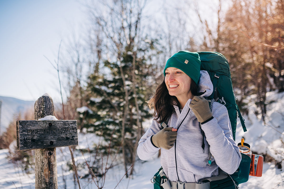 women winter hiking while wearing kodiak fleece hoodie