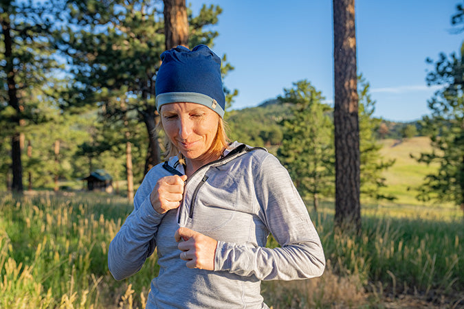 woman outside wearing micro weight woolverino 1/4 zip and reversible shade beanie