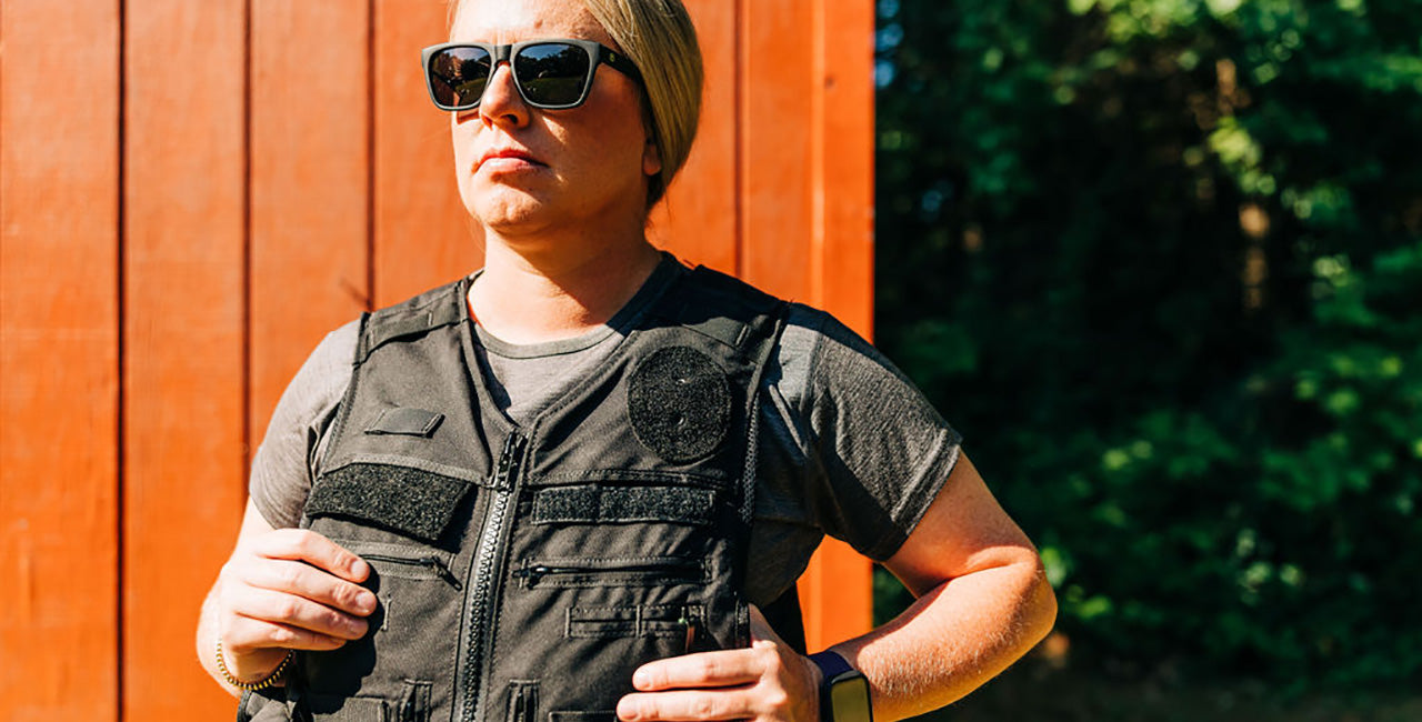 woman wearing bullet proof vest with a lightweight crew top on