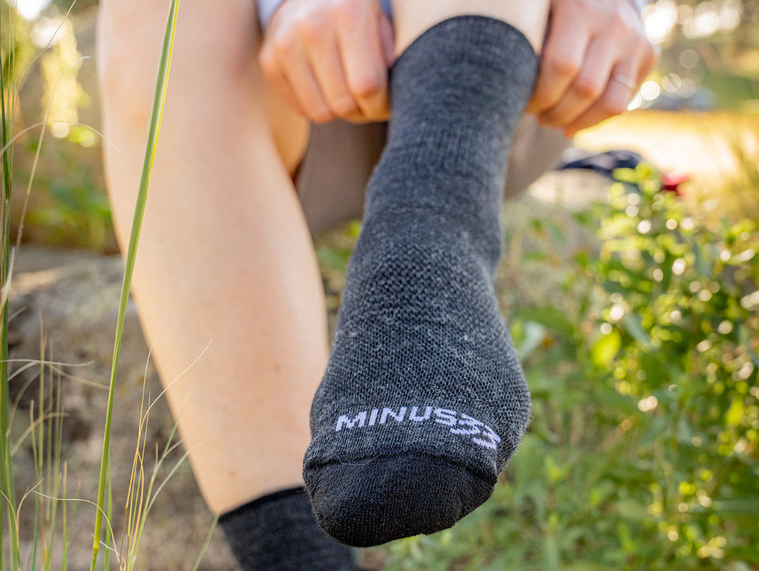 NH USA made socks merino wool putting socks on to go for a run