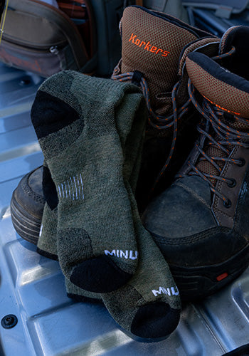 mountain heritage socks on top of boots